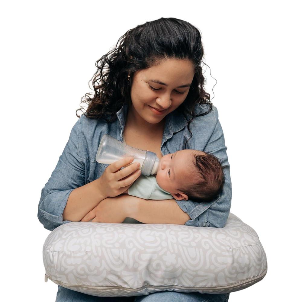 imageBoppy Nursing Pillow  Ergonomic Bottle ampamp Breastfeeding Pillow with High Firm Large Area WaterRepellent Cushion with Washable Cover Baby Safety Alliance Verified  Oatmeal BoucleCream Retro Squiggles